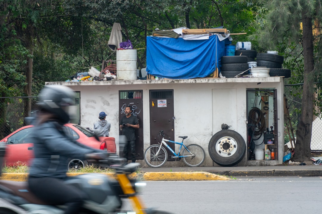 small-makeshift-structure-with-tires-and-blue-tarp-6inzeblbode